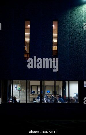 Students working in the library, Aberystwyth University, exterior, night, Wales UK Stock Photo