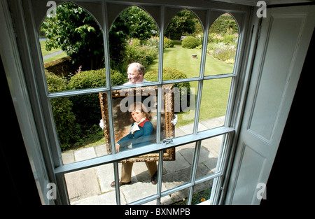 Tom Carpenter, Trustee of Jane Austen's House in Chawton, Hampshire, carries a newly acquired painting of Jane Austen's brother Stock Photo