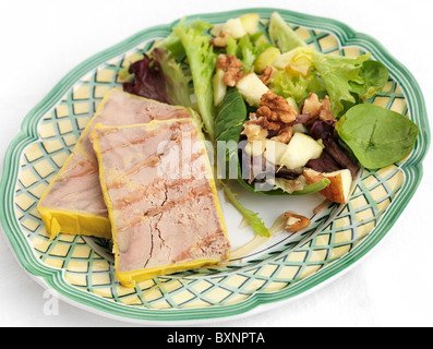 Foie gras with walnut salad and honey dressing Stock Photo