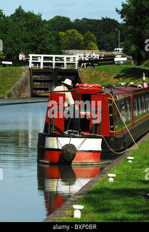 A moored narrow boat on Kennet and Avon Canal near Caen Hill Locks. Wiltshire, UK June 2010 Stock Photo