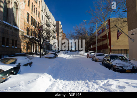 Cars buried in the snow on West 105th Street in New York City after a blizzard dumped more than two feet of snow on the city Stock Photo