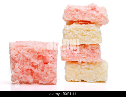 Coconut Ice confectionery isolated on white from low perspective. Stock Photo