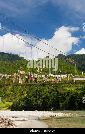 prayer flags on a suspension bridge, Punakha, Bhutan, Asia Stock Photo