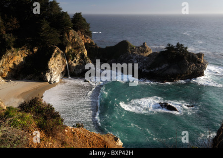 McWay waterfall falls falling into ocean Julia Pfeiffer Burns state park Pacific Highway One 1 California Big Sur coastline Stock Photo