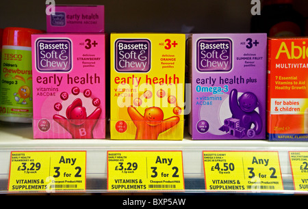 boxes of childrens vitamins tablets on a supermarket shelf Stock Photo