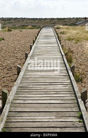 Wooden Boardwalk on a shingle beach Dungerness Kent Stock Photo