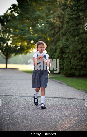 girl walking home from school Stock Photo - Alamy