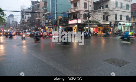 Motorscooters on a busy Hanoi street Stock Photo