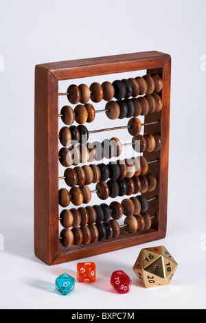 Wooden Abacus with numbered traditional and multi sided dice Stock Photo