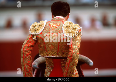 Bullfighting in the arena. The colors and the lights of the fight between a man and a wild animal. Stock Photo
