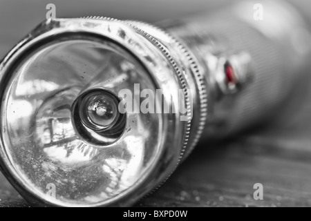 Close up view of a vintage metal flashlight. Stock Photo