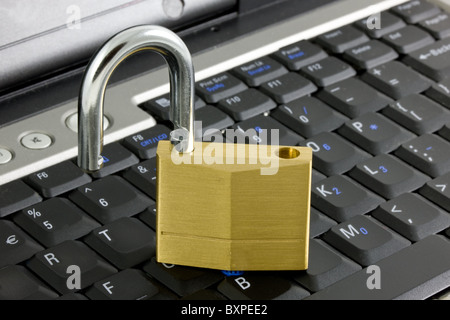 Unlocked padlock on a laptop Stock Photo