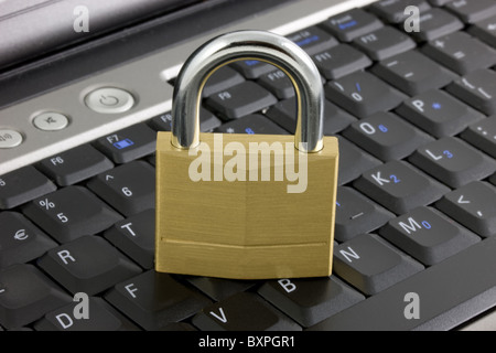 Locked padlock on a laptop Stock Photo