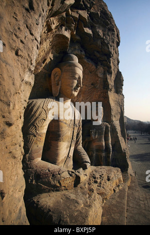 Statues At Ancient Buddhist Temple Grotto. Stock Photo