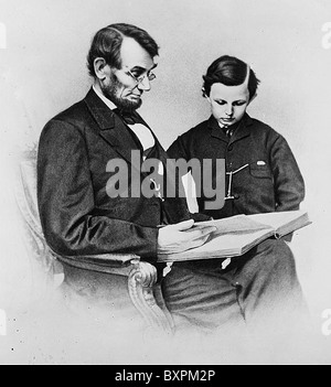 ABRAHAM LINCOLN (1809-65) 16th President of the USA reading to his son Thomas on 9 February 1864. Photo  Matthew Brady Stock Photo