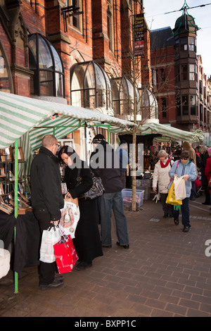 UK, England, Yorkshire, Leeds, Albion Place Christmas Crafts Market, shoppers browsing at stalls Stock Photo