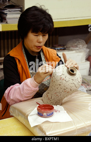 Woman painting celadon vase, Icheon, South Korea Stock Photo