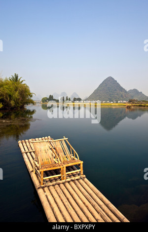 China, Guangxi Province, Yangshuo. Bamboo rafting on the Jade Dragon River. Stock Photo