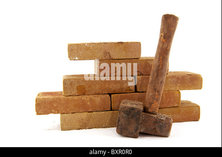 bricks and hammerto build a wall or making pavement Stock Photo