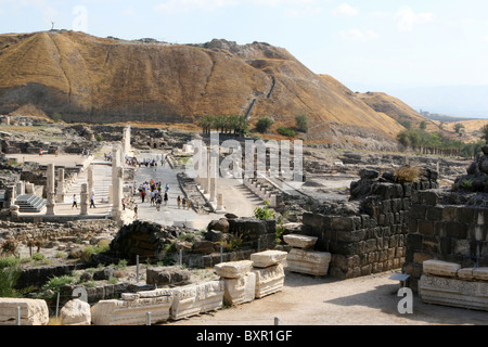 Tourists walk the ancient streets of Bet Shean National Park in Israel. Stock Photo