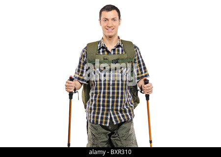 A man in sportswear with backpack and hiking poles Stock Photo