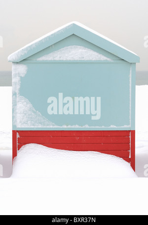A beach hut covered in snow Stock Photo