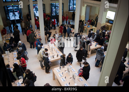 Paris, France, People Shopping, Apple Store, Inside, Aerial View, Crowd in Showroom, looking at phones store, contemporary retail interior design Stock Photo