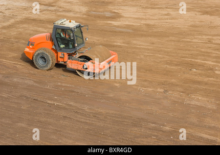 Vibratory soil compactor. HAMM 3000 series in action. Stock Photo