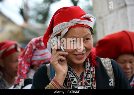 Woman from Red Dao ethnic minority speaking on mobile, Sapa, Vietnam Stock Photo