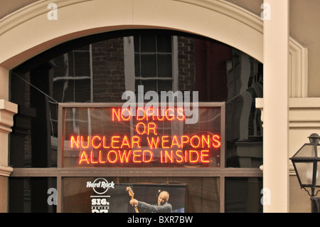 No Drugs or Nuclear Weapons Allowed Inside' neon sign on Bourbon Street, French Quarter, New Orleans, Louisiana Stock Photo