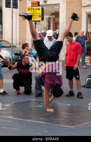 Streetdancer/Breakdancer in front of Basilica dei Santi Ambrogio e Carlo al Corso, Rome, Italy Stock Photo