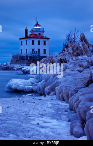 Wintry, Icy night at Fairport Harbor Lighthouse, Fairport Ohio USA Stock Photo