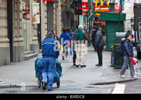 Postal carrier in Manhattan, New York City Stock Photo