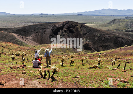 Geologist pointing out features in interior of Tecolote cinder cone, El Pinacate Biosphere Reserve, Sonora, Mexico Stock Photo