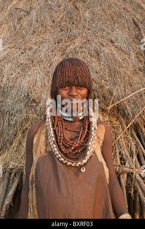 Pregnant Hamar woman with necklaces made of Cowry shells Omo river valley, Southern Ethiopia Africa Stock Photo