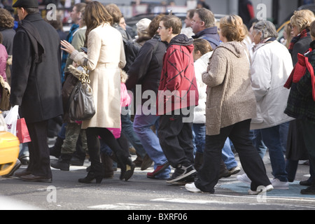 The streets of New York City are extra crowded during the holiday season. Broadway in the Times Square neighborhood. Stock Photo