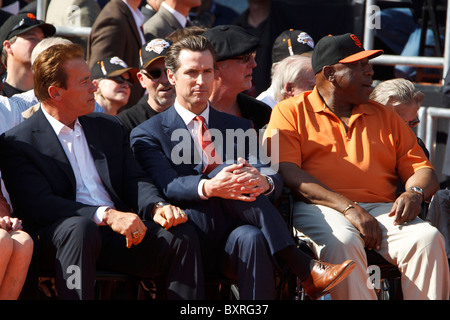 San Francisco, CA, USA;  San Francisco mayor Gavin Newsom sits next to governor Arnold Schwarzenegger and Willie McCovey Stock Photo