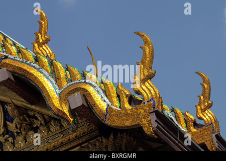 Golden roof decorations on Hor Phra Monthian Dharma at the Wat Phra Kaeo (Kaew) Temple in Bangkok, Thailand Stock Photo