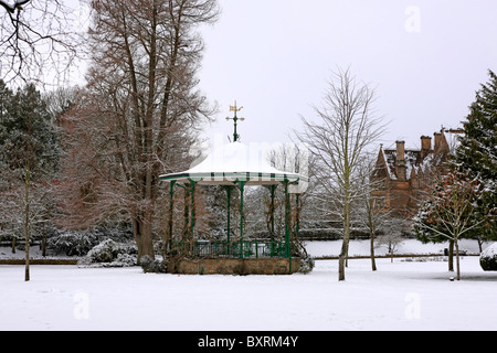 Snow covered Bandstand and gardens in Sherborne' Pageant gardens Dorset Stock Photo