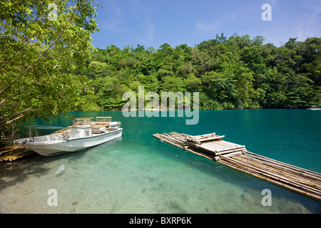 Jamaica, Blue Lagoon, Boat and wooden raft on lagoon Stock Photo