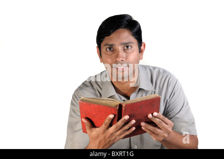 An handsome middle aged man reading an old book Stock Photo
