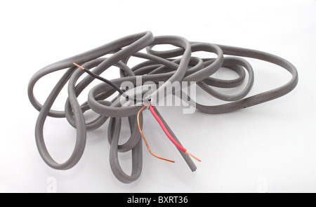 Close up of electric wire on a plain white background. Stock Photo