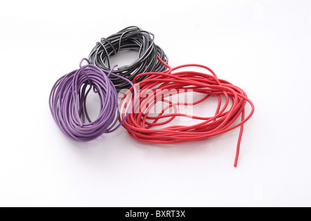 Close up of electric wire on a plain white background. Stock Photo