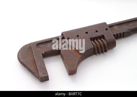 Old adjustable wrench on a plain white background. Stock Photo