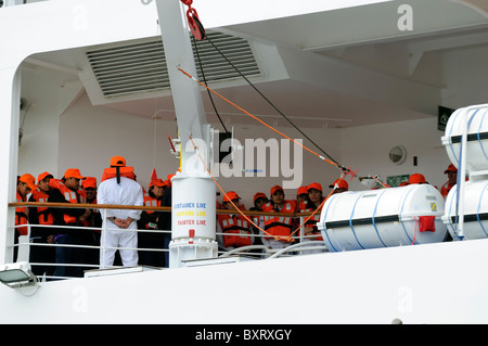 Crew Of A Cruise Ship Practice Lifeboat Drill Stock Photo