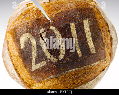 round loaf of bread dusted with the date 2011 Stock Photo