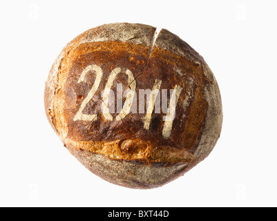 round loaf of bread dusted with the year 2011 Stock Photo