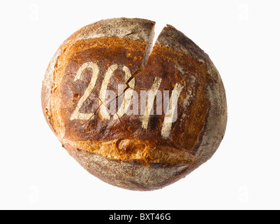 round loaf of bread dusted with a year date Stock Photo