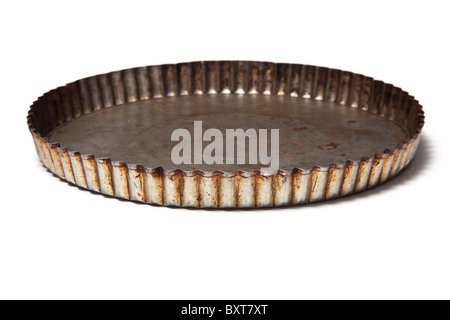 Flan baking tin isolated on a white studio background. Stock Photo