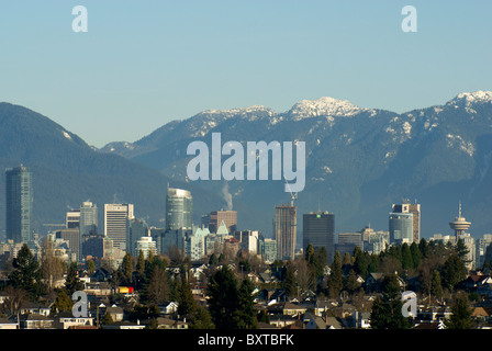 Vancouver skyline in winter with snow on the North Shore Mountains, Vancouver, Canada Stock Photo